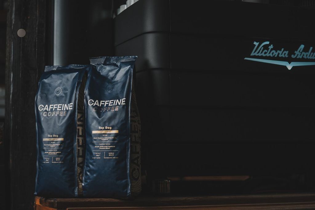 Espresso machine and two bags of Top Dog Espresso Blend